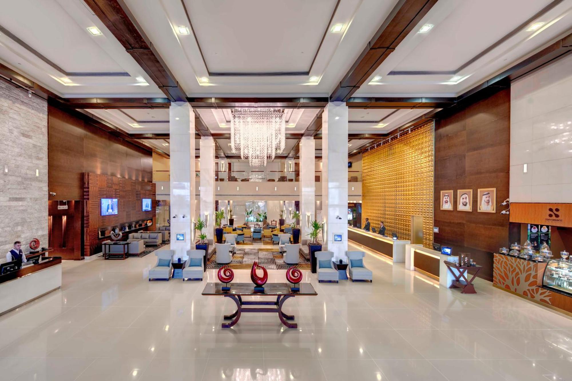 Отель Media Rotana Дубай Экстерьер фото Lobby